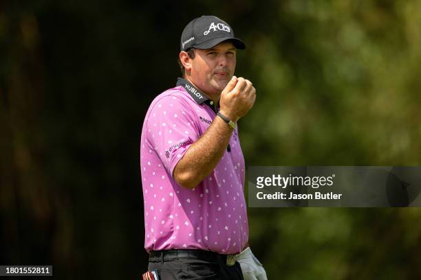 Patrick Reed of the United States cools his fingers before teeing off on hole 3 during the final round of the BNI Indonesian Masters presented by...