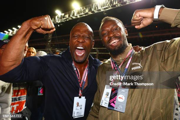 Terry Crews and Usain Bolt pose for a photo on the grid prior to the F1 Grand Prix of Las Vegas at Las Vegas Strip Circuit on November 18, 2023 in...