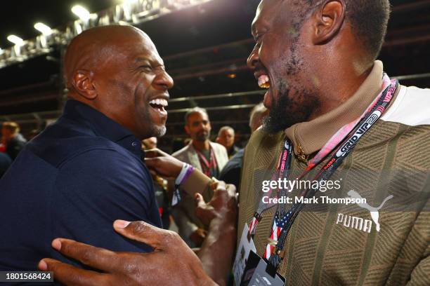 Terry Crews and Usain Bolt pose for a photo on the grid prior to the F1 Grand Prix of Las Vegas at Las Vegas Strip Circuit on November 18, 2023 in...