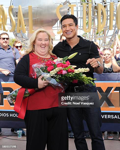 June Shannon and Mario Lopez visit "Extra" at Universal Studios Hollywood on September 9, 2013 in Universal City, California.