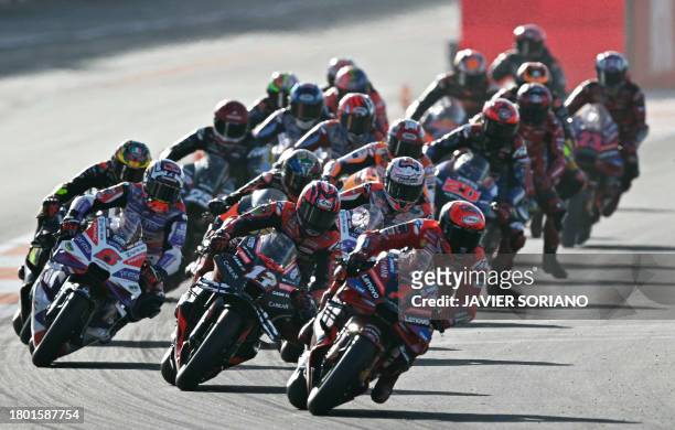 Ducati Italian rider Francesco Bagnaia leads at the start of the sprint race of the MotoGP Valencia Grand Prix at the Ricardo Tormo racetrack in...