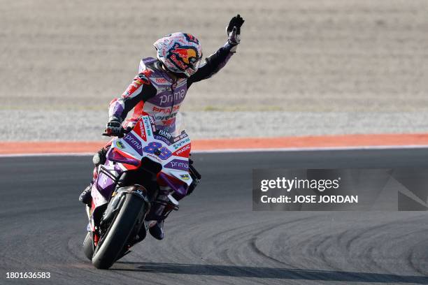 Ducati Spanish rider Jorge Martin celebrates winnig the sprint race of the MotoGP Valencia Grand Prix at the Ricardo Tormo racetrack in Cheste, on...