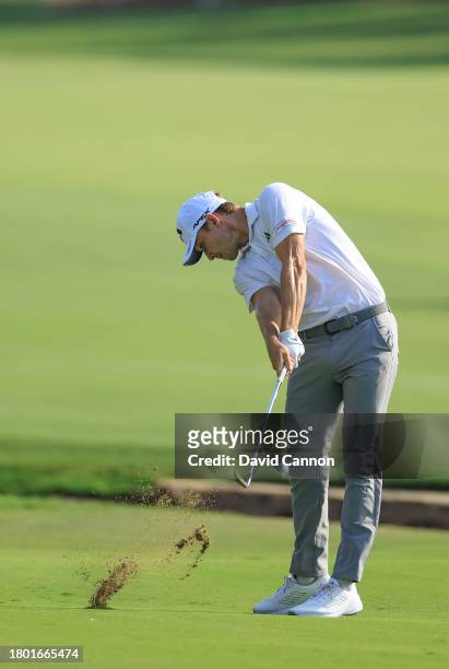 Rasmus Hojgaard of Denmark plays his second shot on the 18th hole during the third round on Day Three of the DP World Tour Championship on the Earth...