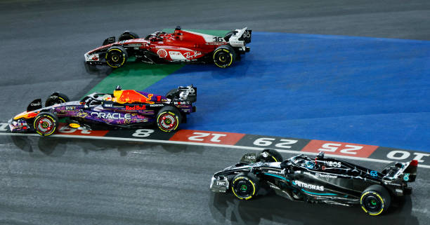 F1 Grand Prix of Las Vegas - RaceLAS VEGAS, NEVADA - NOVEMBER 18: Max Verstappen of the Netherlands driving the (1) Oracle Red Bull Racing RB19 overtakes Charles Leclerc of Monaco driving the (16) Ferrari SF-23 at turn one during the F1 Grand Prix of Las Vegas at Las Vegas Strip Circuit on November 18, 2023 in Las Vegas, Nevada.