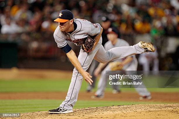 Middle relief pitcher Philip Humber of the Houston Astros follows through on a pitch against the Oakland Athletics in fifth inning at O.co Coliseum...