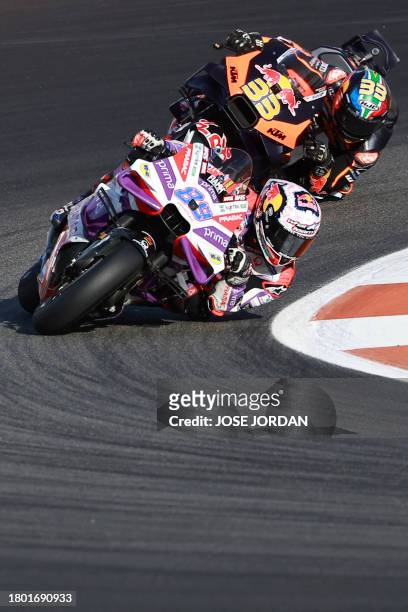 Ducati Spanish rider Jorge Martin and KTM South African rider Brad Binder compete in the sprint race of the MotoGP Valencia Grand Prix at the Ricardo...