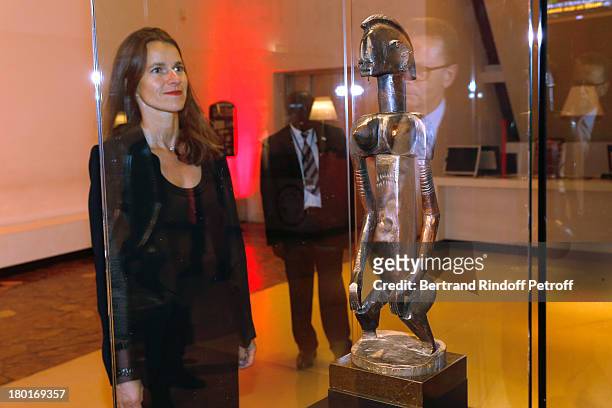 Minister of Culture and Communication Aurelie Filippetti front of Dogon feminine statue from Seno plain , offered to Musee du Quai Branly by 'Friends...