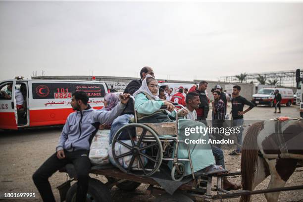 Palestinians transfer their relatives, who had been injured in the Israeli attacks on Gaza and were receiving treatment in hospitals located in the...