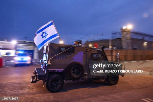 Israeli security forces are seen outside Ofer military prison located between Ramallah and Baytunia in the occupied West Bank city amid preparations...