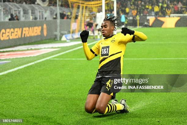 Dortmund's English forward Jamie Bynoe-Gittens celebrates scoring the 3-2 goal during the German first division Bundesliga football match between BVB...