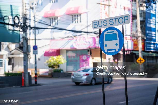 bus stop road sign in chiang mai - australian bus driver stock pictures, royalty-free photos & images