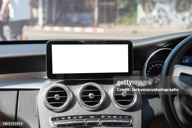 a digital display screen on the dashboard of a modern car - cruscotto foto e immagini stock