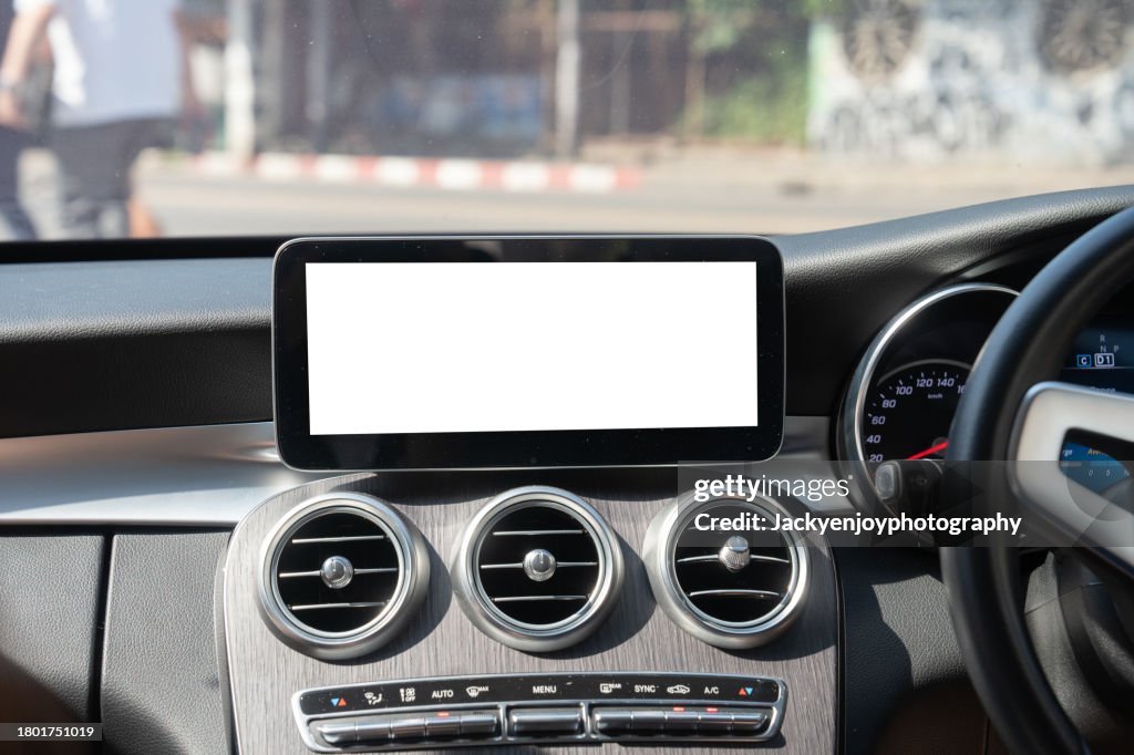 A digital display screen on the dashboard of a modern car