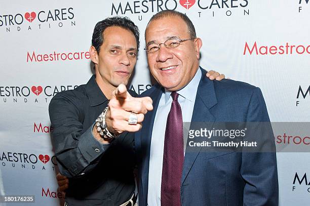 Marc Anthony and Maestro Cares Foundation founder Henry Cardenas attend 2nd Annual Maestro Cares Chicago Fundraiser at Y-Bar on September 9, 2013 in...