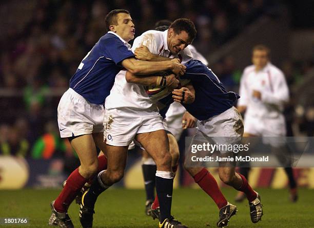 Martin Johnson of England is tackled by Damien Traille of France during the RBS Six Nations International match between England and France on...