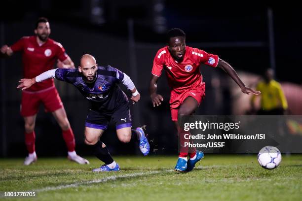 November 18: Chijioke Otuonye of Tennessee Tempo FC and Tre Bonaparte of South Carolina United Heat battle during a US Open Cup qualifying match...