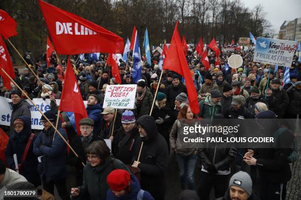 Supporters of former Linke politician Sahra Wagenknecht take part in a demonstration against war and arming, in Berlin, on November 25, 2023.