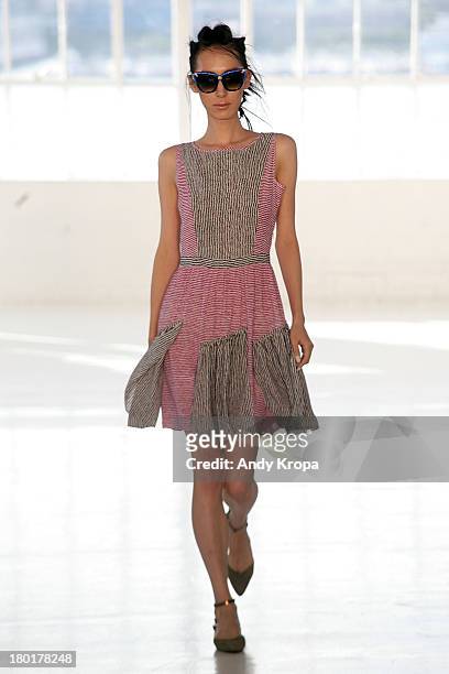 Model walks the runway at the Love By Diego Binetti fashion show during Mercedes-Benz Fashion Week Spring 2014 at The Designer's Loft at Studio 450...
