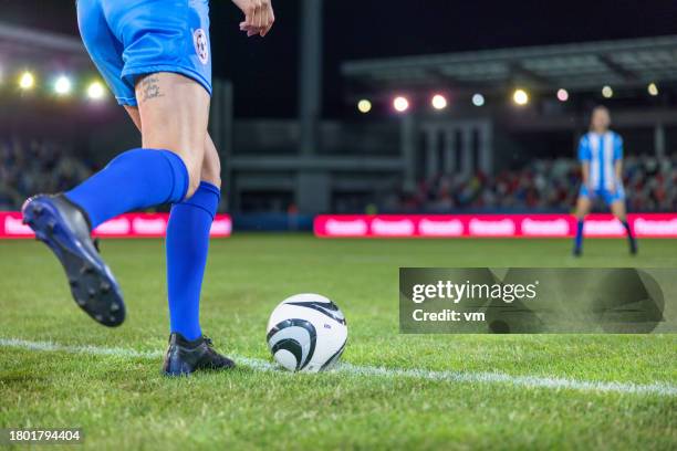 female soccer player legs doing kick off - penalty kick stock pictures, royalty-free photos & images