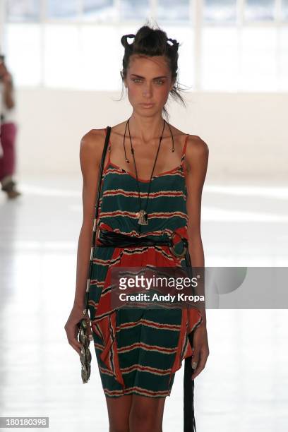 Model walks the runway at the Love By Diego Binetti fashion show during Mercedes-Benz Fashion Week Spring 2014 at The Designer's Loft at Studio 450...