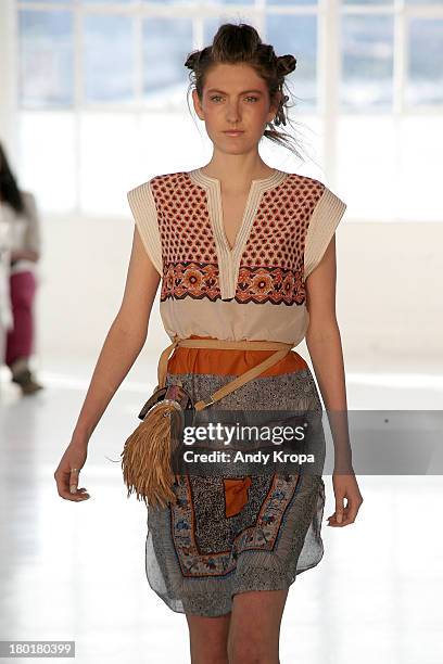 Model walks the runway at the Love By Diego Binetti fashion show during Mercedes-Benz Fashion Week Spring 2014 at The Designer's Loft at Studio 450...