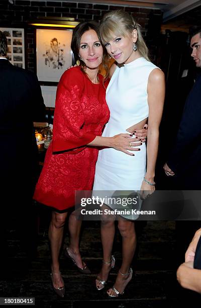 Actress Julia Roberts and singer Taylor Swift at the Grey Goose vodka party for The Weinstein Company and eOne Entertainments "August: Osage County"...