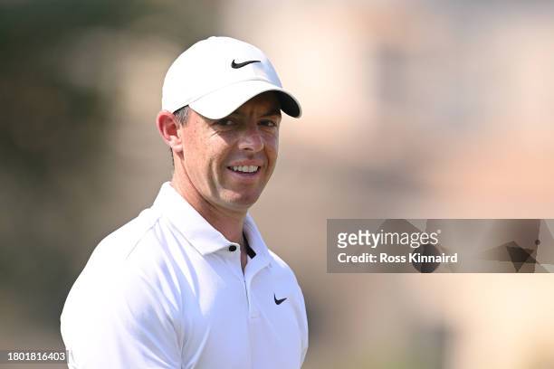 Rory McIlroy of Northern Ireland smiles on the ninth green during Day Four of the DP World Tour Championship on the Earth Course at Jumeirah Golf...