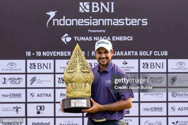 Gaganjeet Bhullar of India holds the trophy after winning the BNI Indonesian Masters presented by Tunas Niaga Energi at Royale Jakarta Golf Club on...