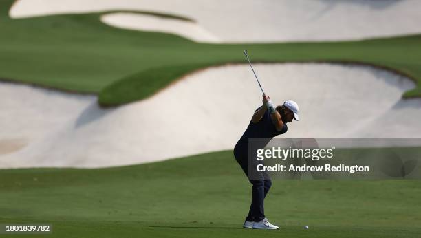 Tommy Fleetwood of England plays his second shot on the fifth hole during Day Four of the DP World Tour Championship on the Earth Course at Jumeirah...