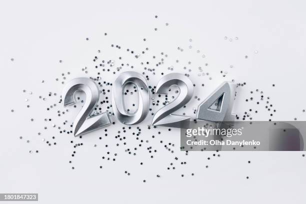 silver numbers 2024 with star shape glitter on a white background - star confetti white background stockfoto's en -beelden