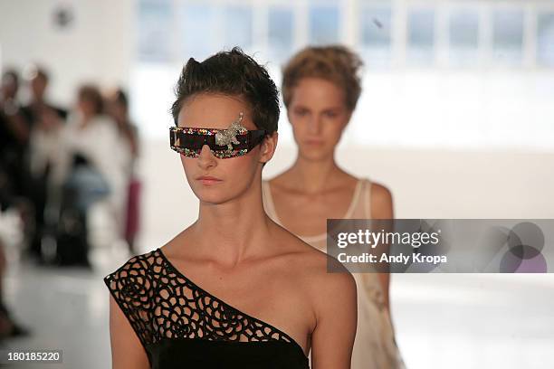 Models walk the runway at the Love By Diego Binetti fashion show during Mercedes-Benz Fashion Week Spring 2014 at The Designer's Loft at Studio 450...