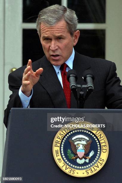 President George W. Bush answers reporters' questions in the Rose Garden at the White House in Washington, DC 28 October 2003. Bush answered...