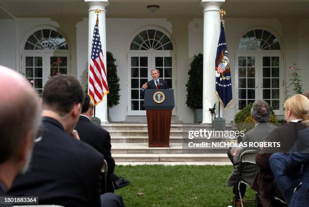 President George W. Bush answers reporters' questions in the Rose Garden at the White House in Washington, DC, 28 October, 2003. Bush answered...