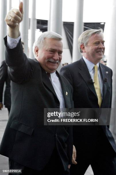 Former Polish president and guest of honour, Lech Walesa gives a thumbs up as he walks with European parliament president, Pat Cox as they take part...
