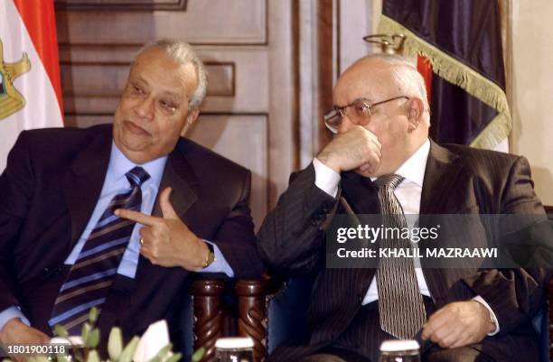 Egyptian Prime Minister Atef Ebeid talks to his Syrian counterpart Mohammed Naji al-Otri during their meeting in Amman 25 January 2004. The prime...