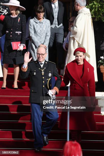 Princess Caroline of Hanover, Princess Stephanie of Monaco, Prince Albert II of Monaco and Princess Charlene of Monaco leave the mass at the...