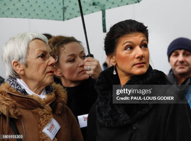 Former Linke politician Sahra Wagenknecht stands next to German journalist and author Gabriele Krone-Schmalz as she takes part in a demonstration...