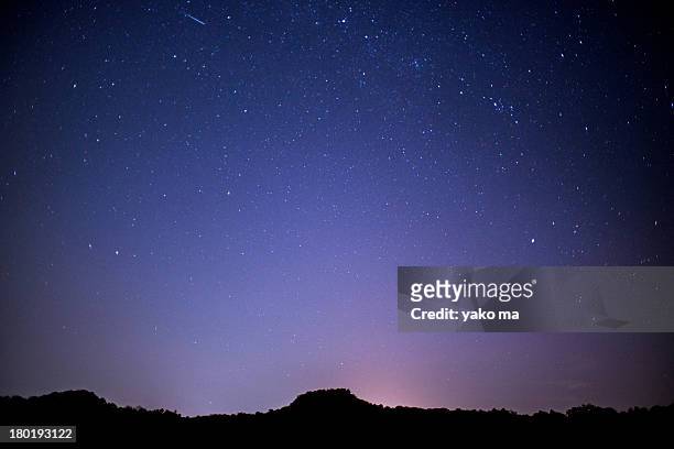a shooting star - clear sky mountain stock pictures, royalty-free photos & images