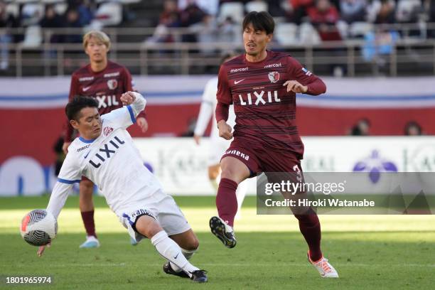 Gen Shoji of Antlers Legends and Masaki Fukai of Mo10 Friends compete for the ball during the Masashi Motoyama testimonial at Kashima Soccer Stadium...