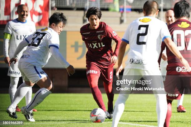 Atsuto Uchida of Antlers Legends and Shoji Kaneko of Mo10 Friends compete for the ball during the Masashi Motoyama testimonial at Kashima Soccer...