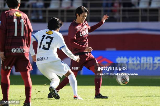 Atsuto Uchida of Antlers Legends and Shinzo Koroki of Mo10 Friends compete for the ball during the Masashi Motoyama testimonial at Kashima Soccer...