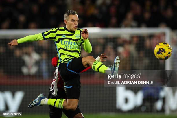 Arsenal's Belgian midfielder Leandro Trossard controls the ball during the English Premier League football match between Brentford and Arsenal at the...
