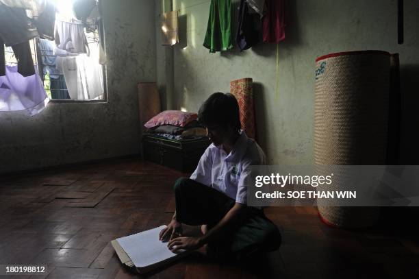 Visually-impaired student studies in a room at the Yangon Education Centre for the Blind in Yangon on September 10, 2013. The Khaweichan School...