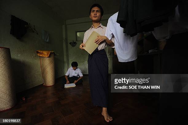 Blind and visually-impaired students attend a lesson in a room at the Yangon Education Centre for the Blind in Yangon on September 10, 2013. The...