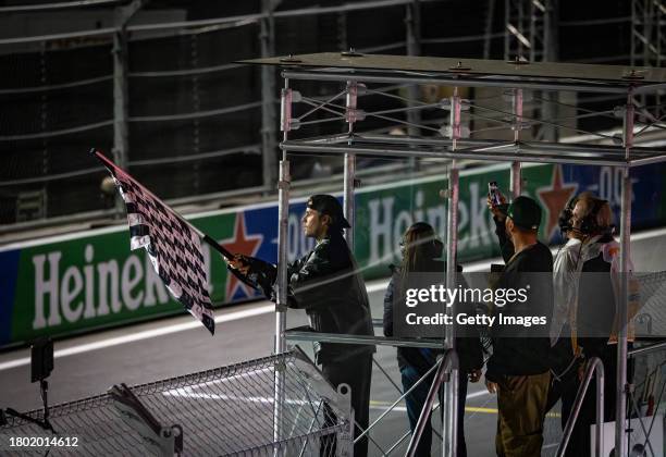 Justin Bieber waves the chequered flag during the F1 Grand Prix of Las Vegas at Las Vegas Strip Circuit on November 18, 2023 in Las Vegas, Nevada.