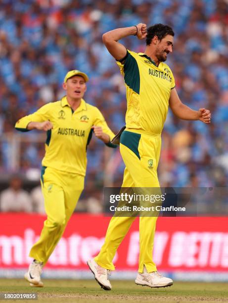Mitchell Starc of Australia celebrates the wicket of KL Rahul of India during the ICC Men's Cricket World Cup India 2023 Final between India and...