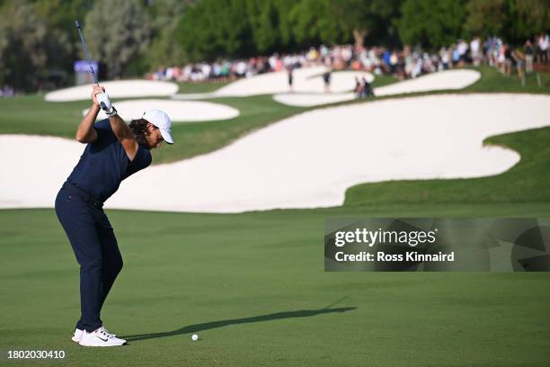 Tommy Fleetwood of England plays his second shot on the 15th hole during Day Four of the DP World Tour Championship on the Earth Course at Jumeirah...