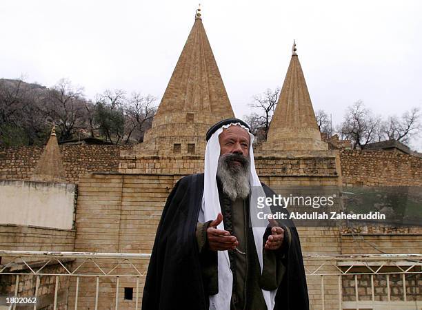Faqeer Berjes prays on the roof of the historic temple of Yazidis in the village of Lalesh February 15, 2003 in northern Iraq. Yazidi is one of the...