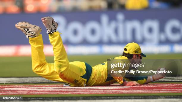 Travis Head of Australia catches Rohit Sharma of India during the ICC Men's Cricket World Cup India 2023 Final between India and Australia at...