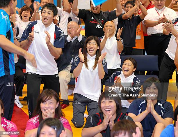 Wrestling Olympic gold medalists Saori Yoshida , Kaori Ichio and Tatsuhiro Yonemitsu celebrate with local residents as wrestling was voted to be...